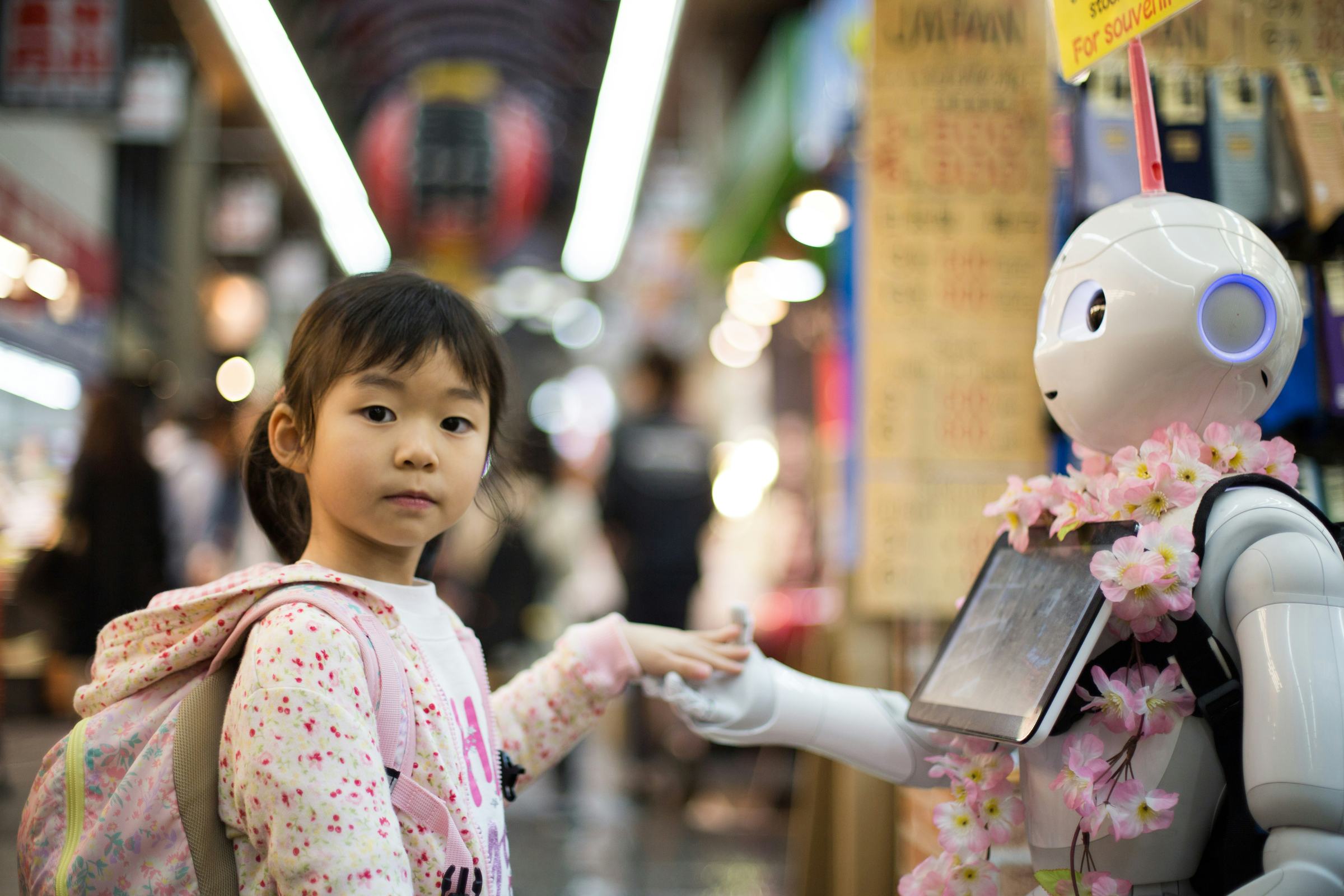 A child meeting a robot: curiosity, and the boundary that keeps it honest