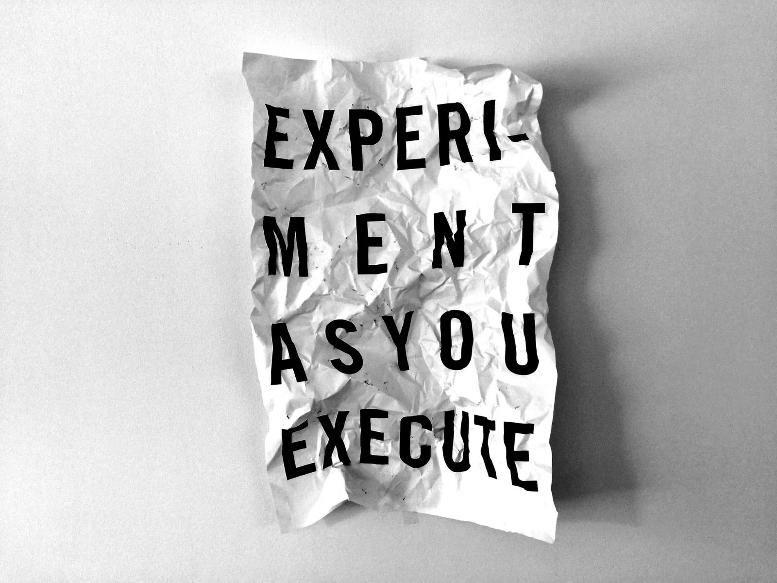 A printed sheet reading Experiment as you execute