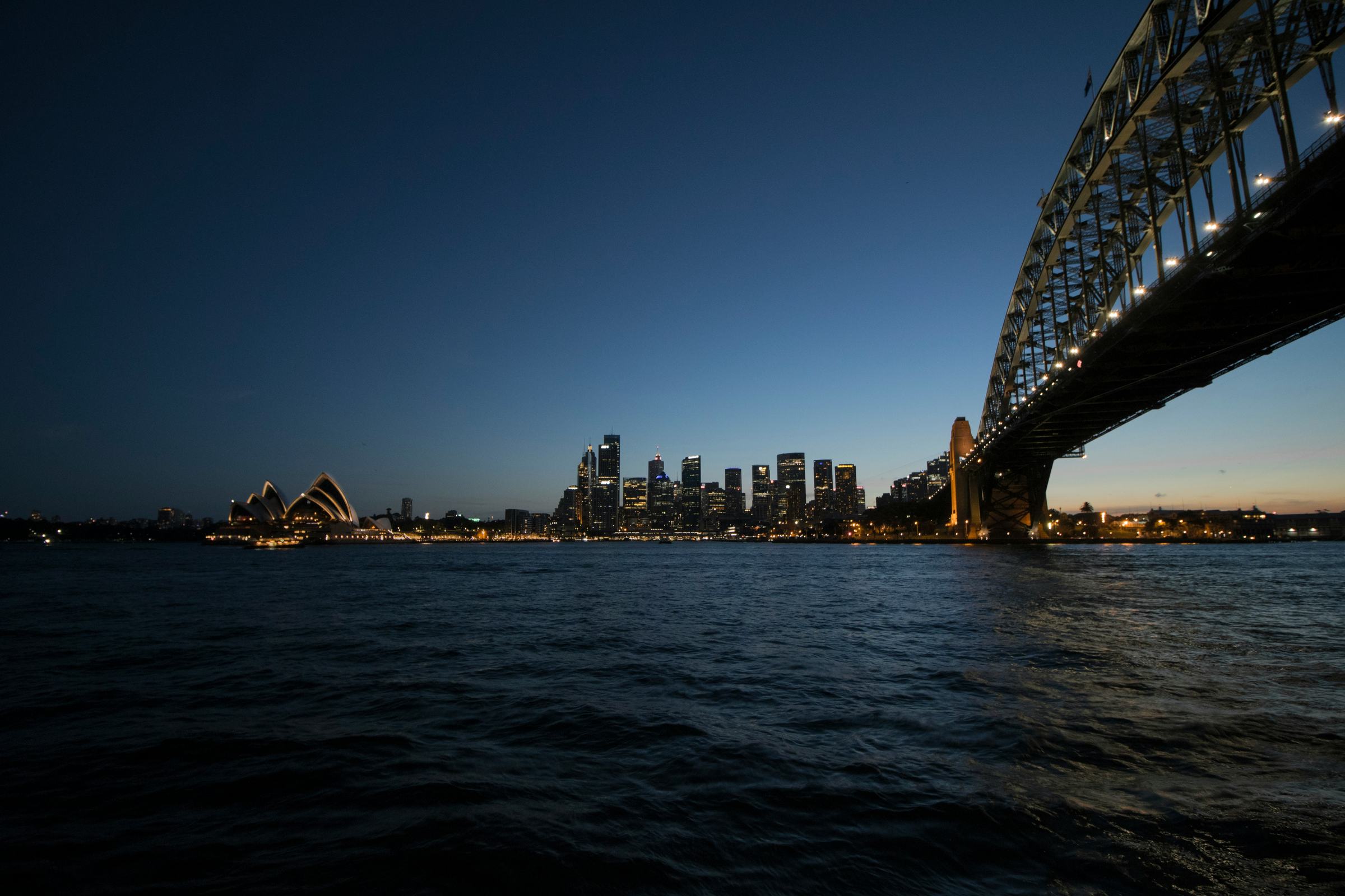 Sydney Harbour at dusk, the bridge and the city skyline