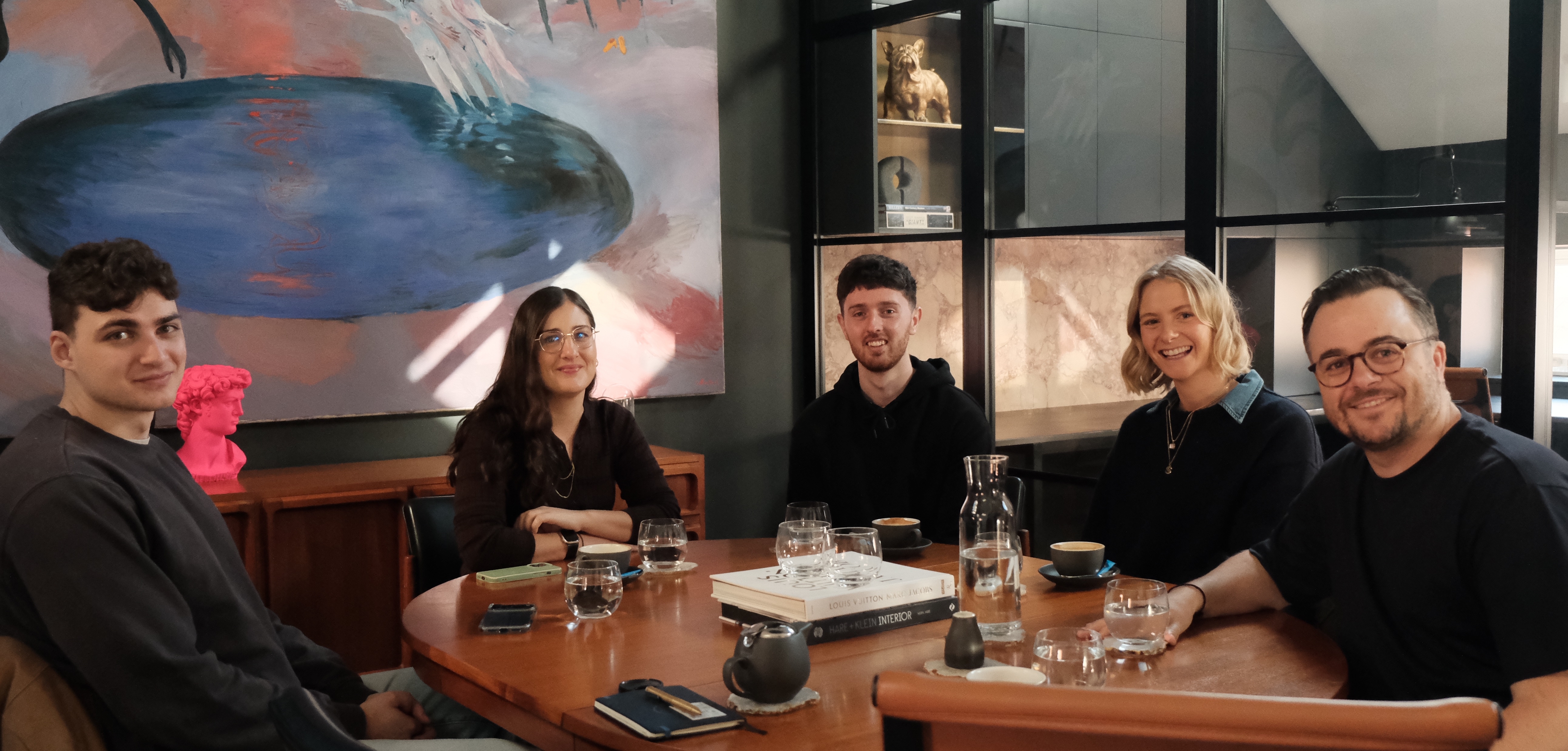 The nicholii team working together around the table